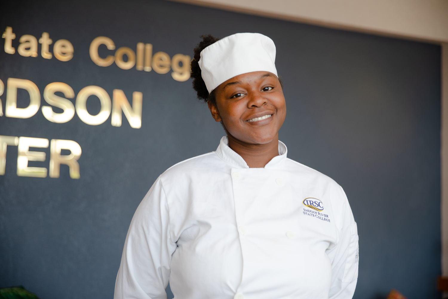 A proud chef greets guests for an event at the richardson center