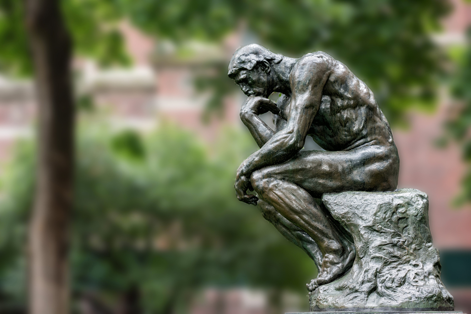 Thinker copper statue at university philosophy building