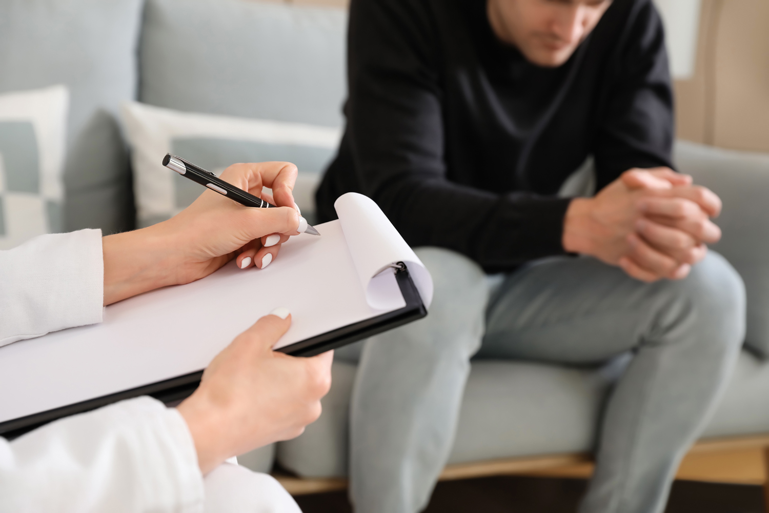 Psychologist working with patient in office, closeup