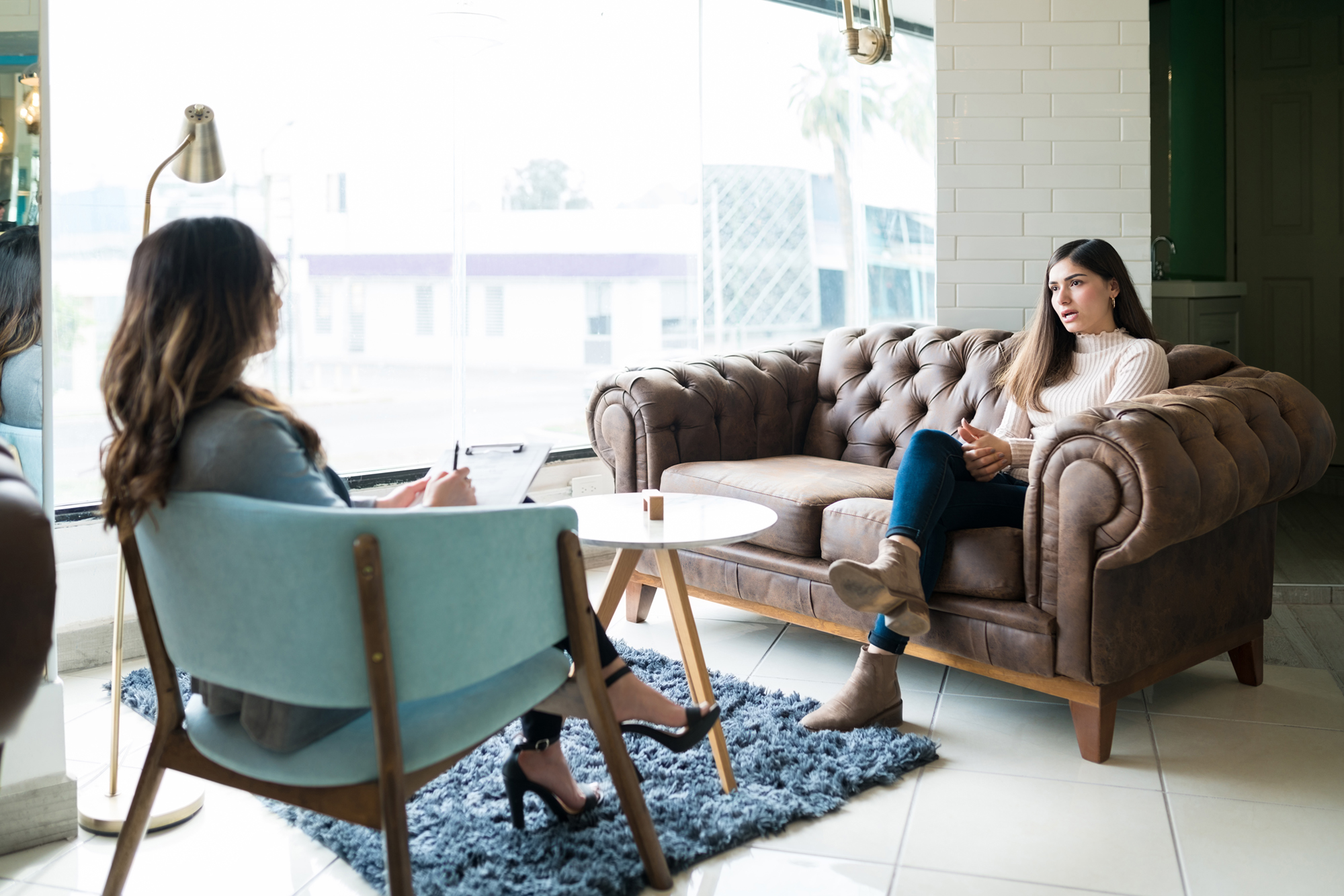 Woman discussing with therapist during session