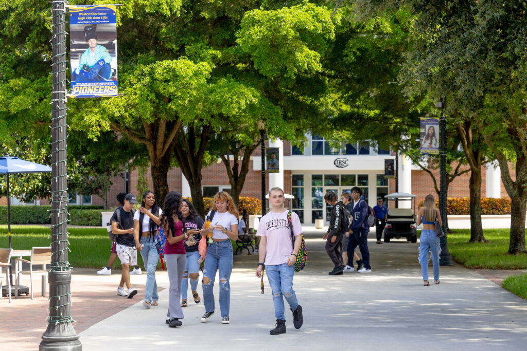 Students move across the courtyard between academic sessions, demonstrating the dynamic life and community at the college's Fort Pierce campus.