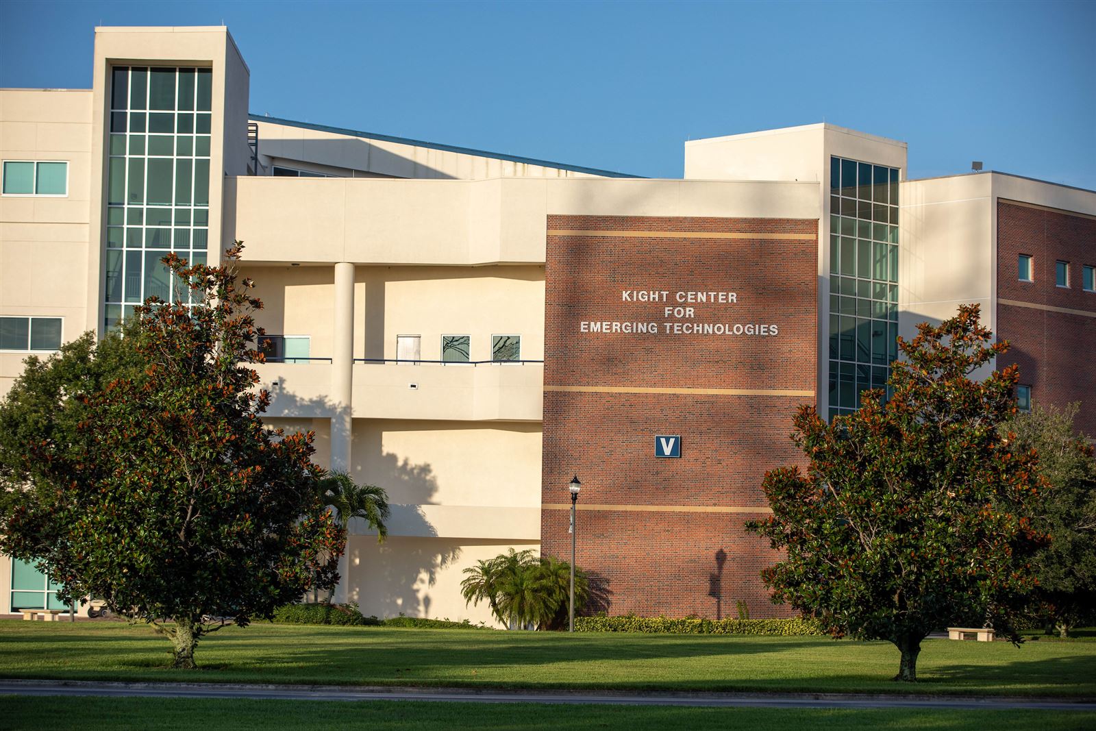 Student smiling outside on campus