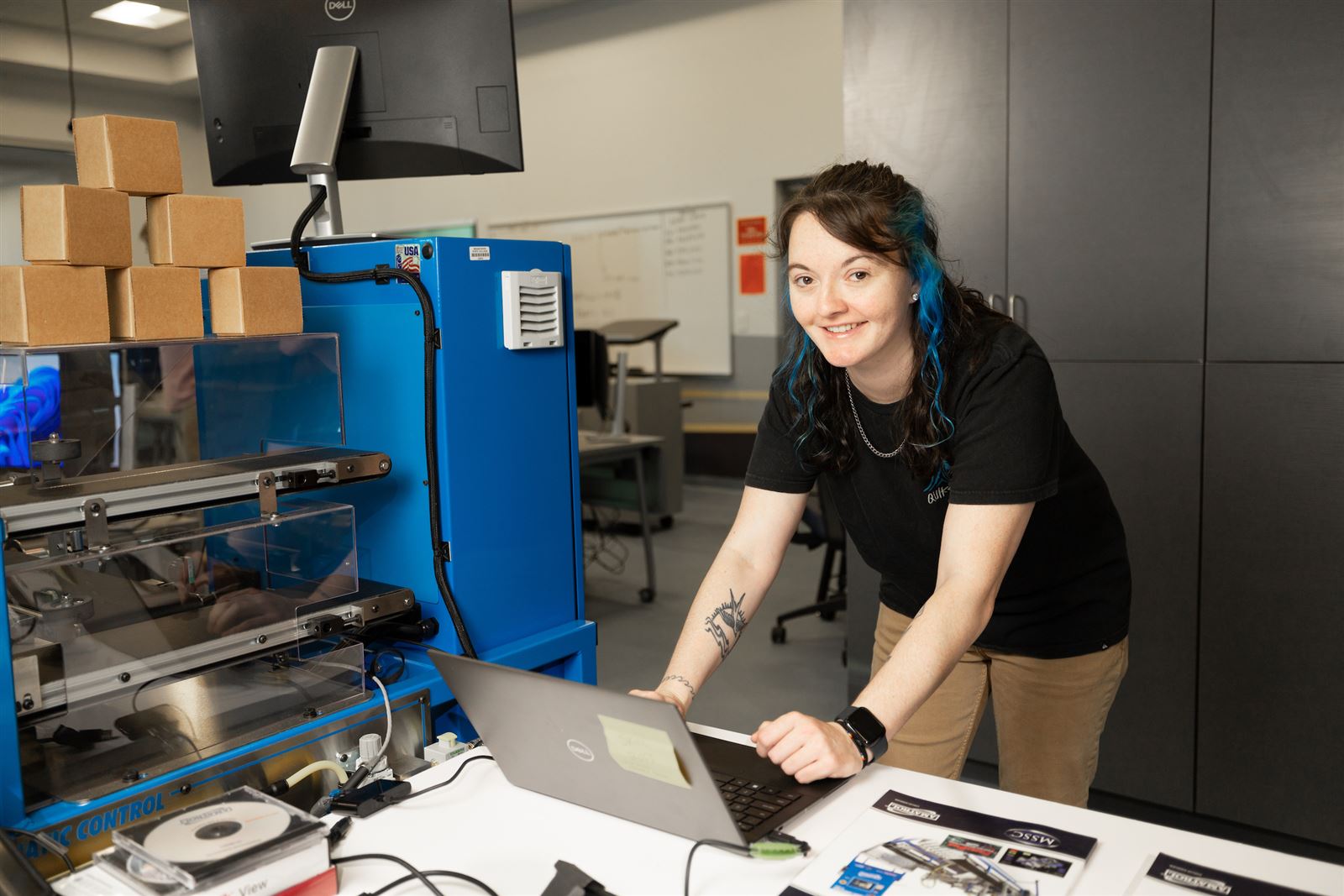 Student working on a laptop in an AI training course